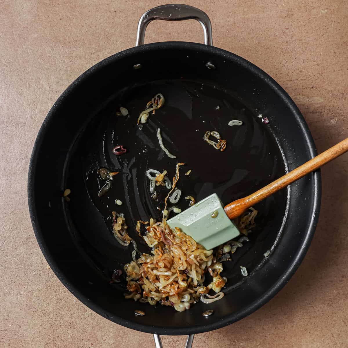 oil, shallots and salt cooking in a large frying pan.