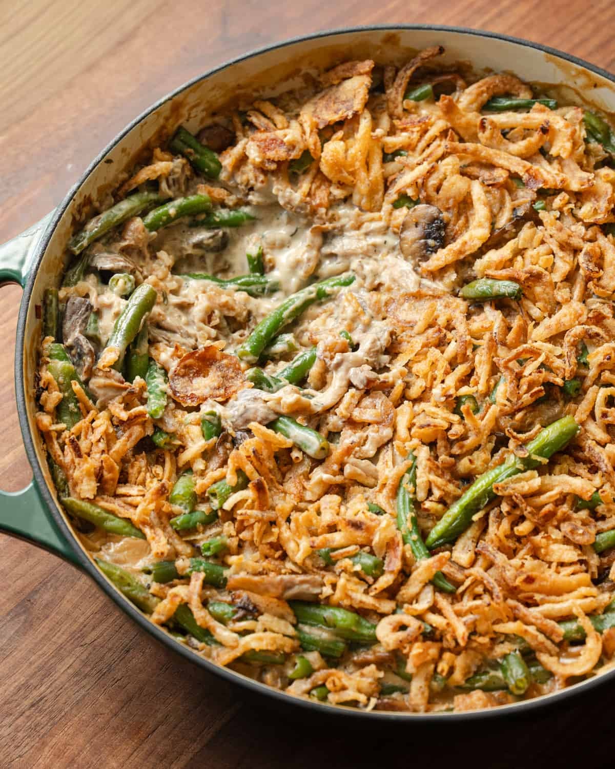 close up overhead shot of green bean casserole in baking dish.
