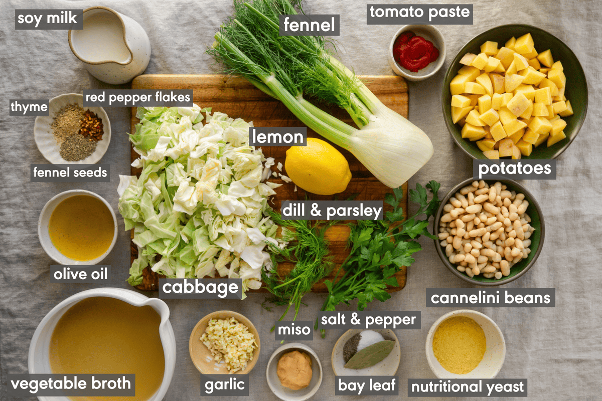 golden cabbage soup ingredients in various small bowls on a table.